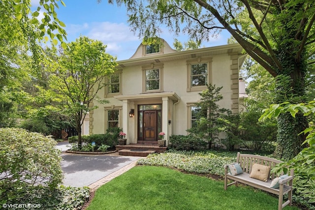 2007 Wilmette Ave, Wilmette, IL 60091 - view of front facade featuring stucco siding and a front yard