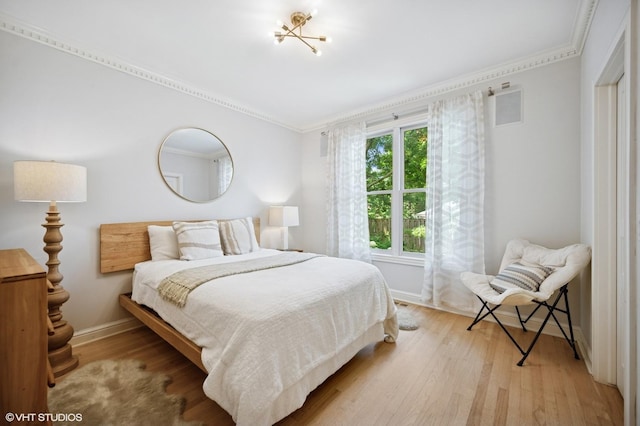 2007 Wilmette Ave, Wilmette, IL 60091 - bedroom with ornamental molding and light wood-style flooring