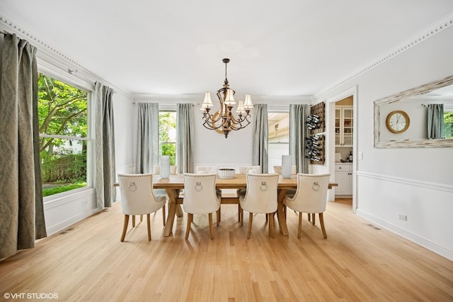 2007 Wilmette Ave, Wilmette, IL 60091 - dining space with a chandelier, light wood-style flooring, and crown molding