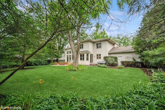 2007 Wilmette Ave, Wilmette, IL 60091 - back of property featuring stucco siding and a yard