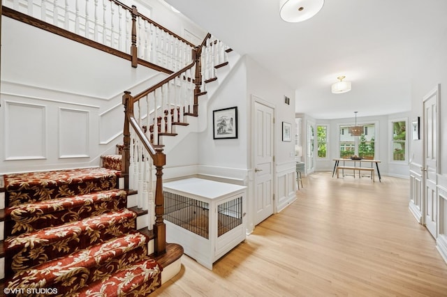 2007 Wilmette Ave, Wilmette, IL 60091 - staircase with a decorative wall and wood finished floors