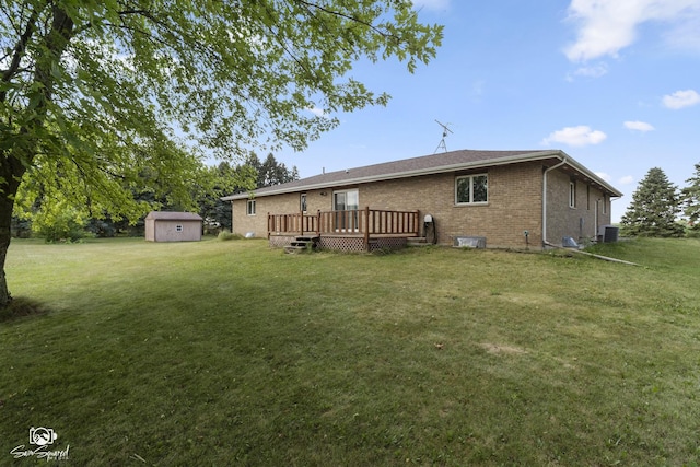 4849 W Kennedy Rd, Peotone, IL 60468 - back of property with a storage unit, a deck, brick siding, and a yard