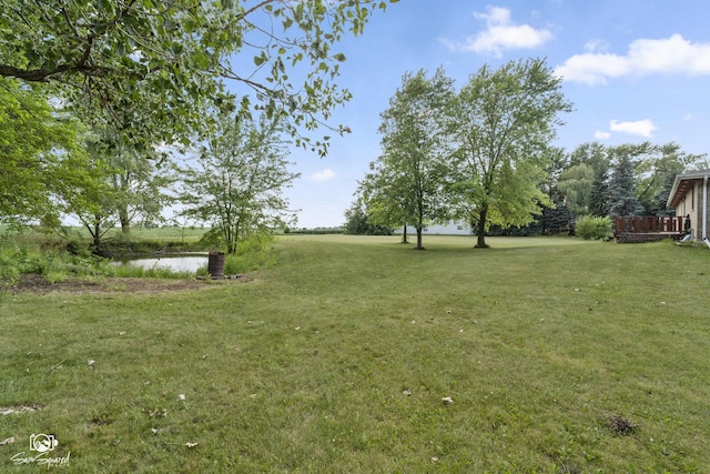 4849 W Kennedy Rd, Peotone, IL 60468 - view of grassy yard featuring a wooden deck