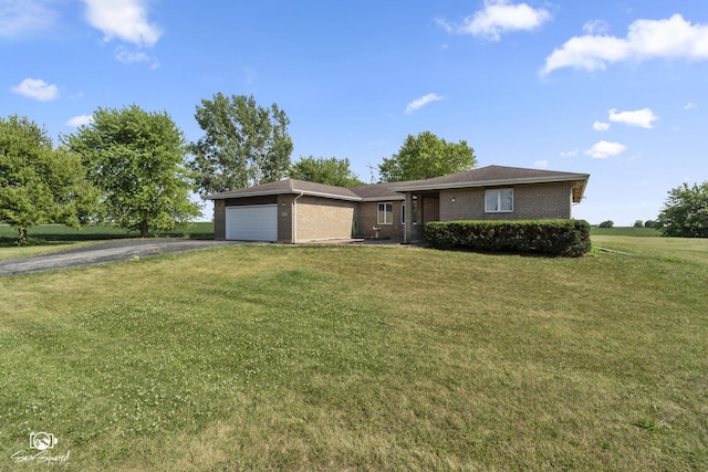 4849 W Kennedy Rd, Peotone, IL 60468 - ranch-style house featuring driveway, brick siding, an attached garage, and a front yard