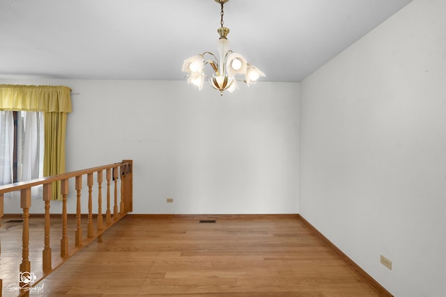 4849 W Kennedy Rd, Peotone, IL 60468 - spare room with light wood-style flooring and a chandelier