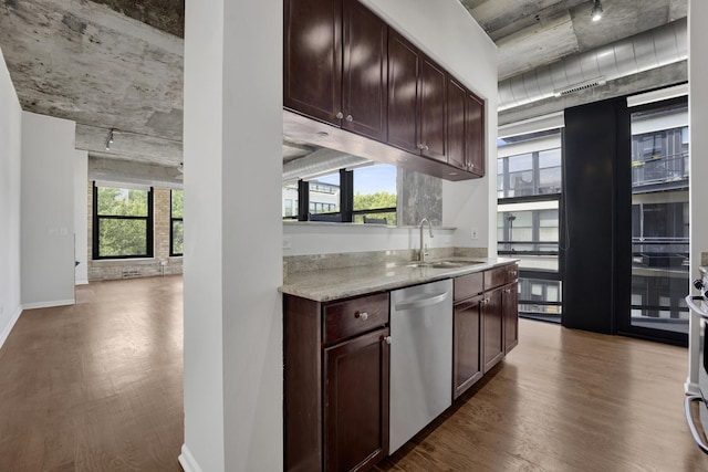 1070 W 15th St Unit 201, Chicago, IL 60608 - kitchen with dishwasher, dark wood-type flooring, track lighting, dark brown cabinets, and light stone countertops