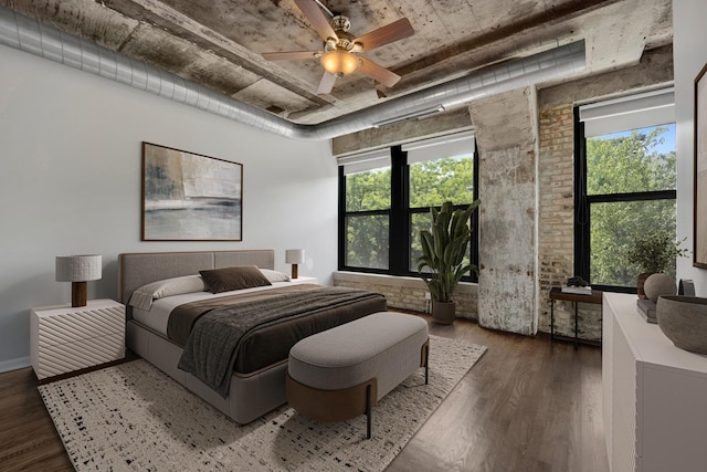 1070 W 15th St Unit 201, Chicago, IL 60608 - bedroom featuring wood finished floors, a ceiling fan, and brick wall