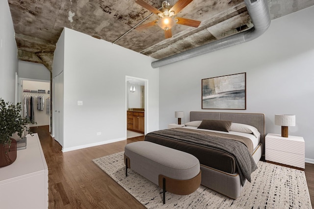 1070 W 15th St Unit 201, Chicago, IL 60608 - bedroom featuring wood finished floors, a spacious closet, connected bathroom, and ceiling fan