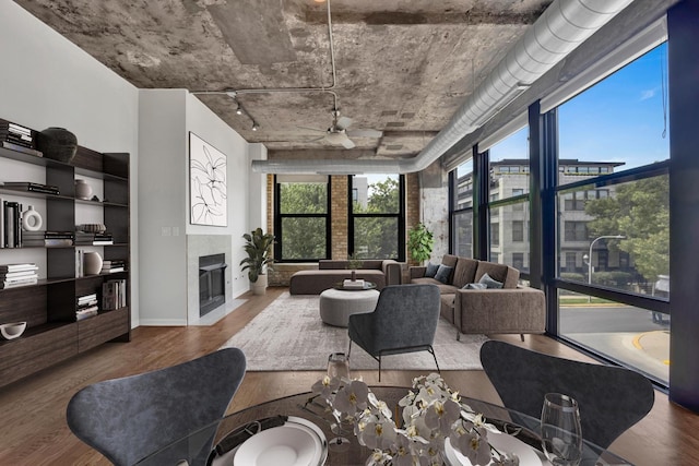 1070 W 15th St Unit 201, Chicago, IL 60608 - living area with ceiling fan, wood finished floors, and a fireplace with flush hearth