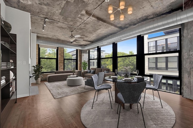 1070 W 15th St Unit 201, Chicago, IL 60608 - dining space featuring healthy amount of natural light, floor to ceiling windows, wood finished floors, and a chandelier