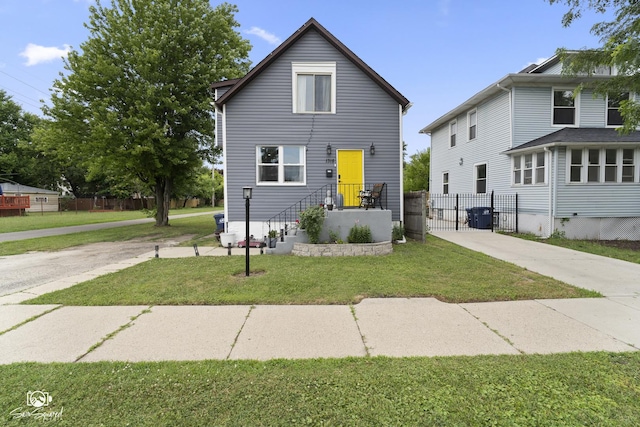 1318 S 6th Ave, Maywood, IL 60153 - view of front of home with a gate and concrete driveway