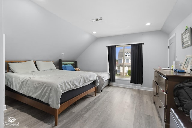 1318 S 6th Ave, Maywood, IL 60153 - bedroom featuring lofted ceiling, light wood-style flooring, and recessed lighting