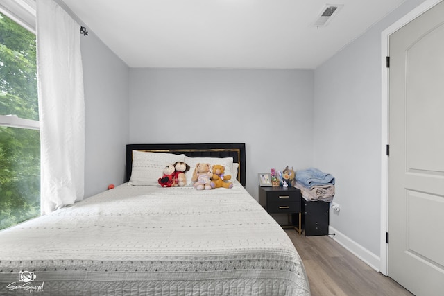1318 S 6th Ave, Maywood, IL 60153 - bedroom featuring wood finished floors and multiple windows