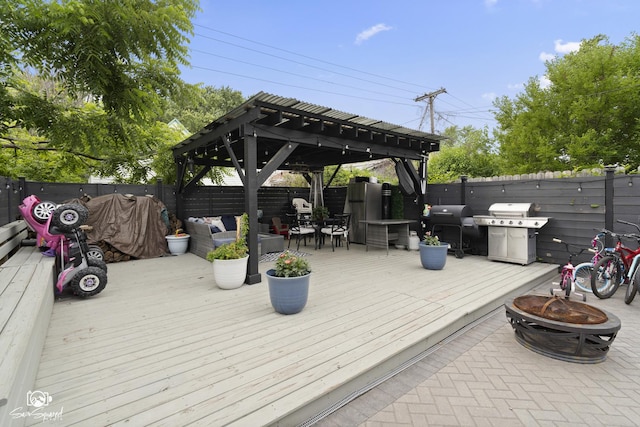 1318 S 6th Ave, Maywood, IL 60153 - wooden terrace featuring an outdoor fire pit, a fenced backyard, area for grilling, and a gazebo