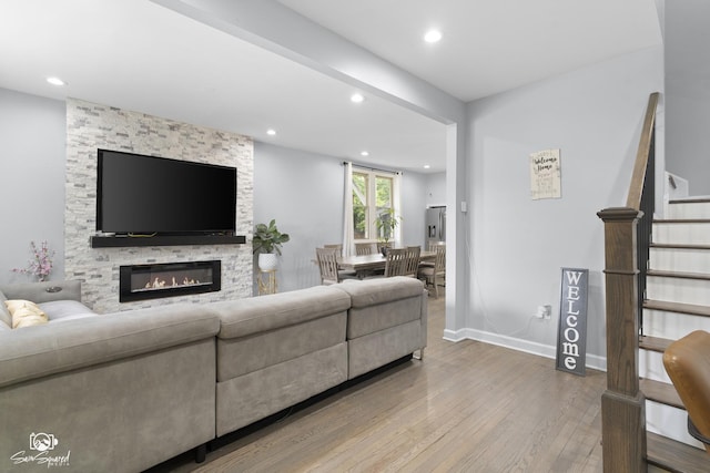 1318 S 6th Ave, Maywood, IL 60153 - living area with hardwood / wood-style floors, stairs, recessed lighting, and a fireplace