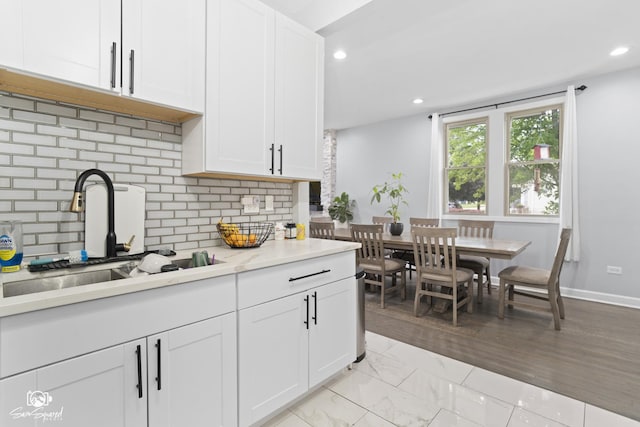 1318 S 6th Ave, Maywood, IL 60153 - kitchen with light countertops, recessed lighting, white cabinets, and backsplash