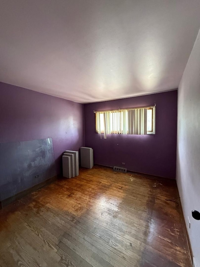 15203 Waterman Dr, South Holland, IL 60473 - spare room featuring wood-type flooring