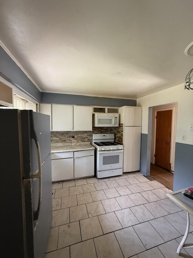 15203 Waterman Dr, South Holland, IL 60473 - kitchen featuring white appliances, white cabinets, decorative backsplash, and light countertops
