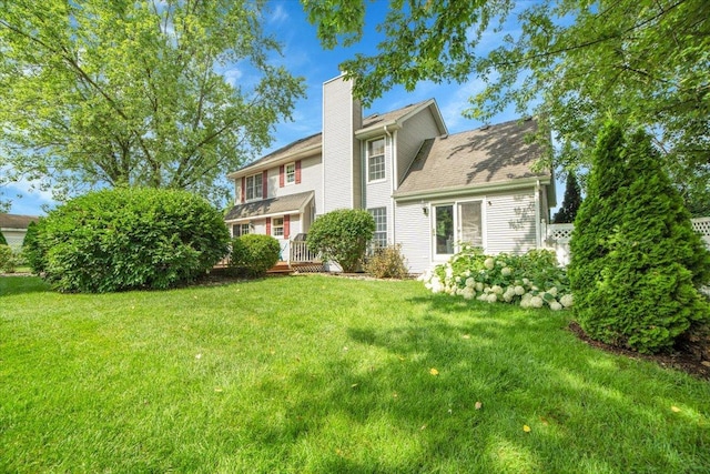 19615 116th Ave, Mokena, IL 60448 - back of house with a chimney and a yard