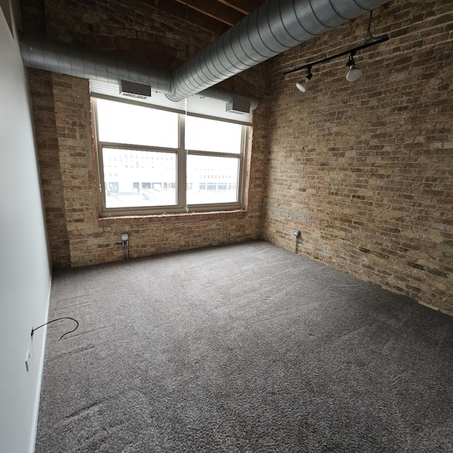 420 S Clinton St Unit 607-A, Chicago, IL 60607 - carpeted empty room featuring brick wall