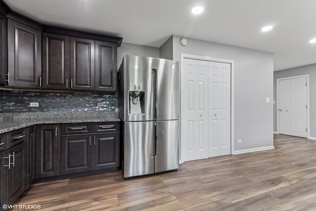 1110 Natalie Dr, West Chicago, IL 60185 - kitchen with stainless steel fridge, wood finished floors, decorative backsplash, recessed lighting, and stone countertops