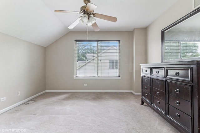 1110 Natalie Dr, West Chicago, IL 60185 - unfurnished bedroom featuring light carpet, lofted ceiling, and a ceiling fan