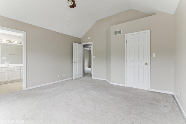 1110 Natalie Dr, West Chicago, IL 60185 - unfurnished bedroom with lofted ceiling, light colored carpet, ensuite bath, and a ceiling fan