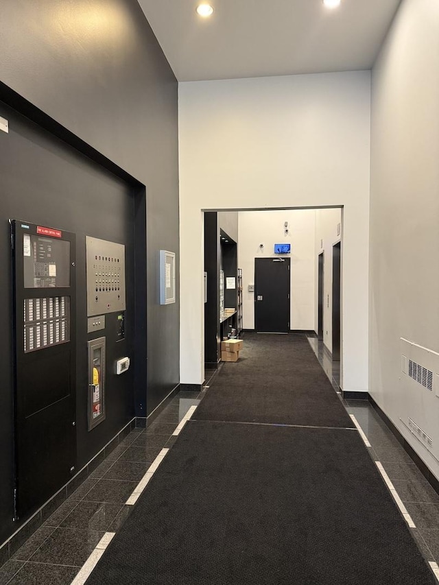 20 N State St Unit 801, Chicago, IL 60602 - corridor with a high ceiling, recessed lighting, and granite tiled floors