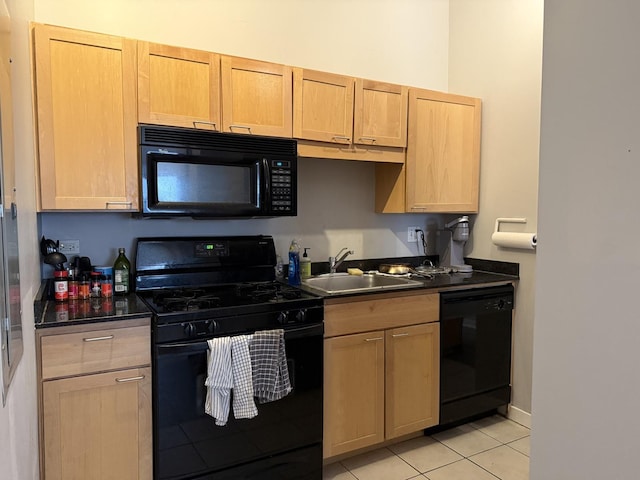 20 N State St Unit 801, Chicago, IL 60602 - kitchen featuring black appliances, dark countertops, light tile patterned floors, and light brown cabinetry