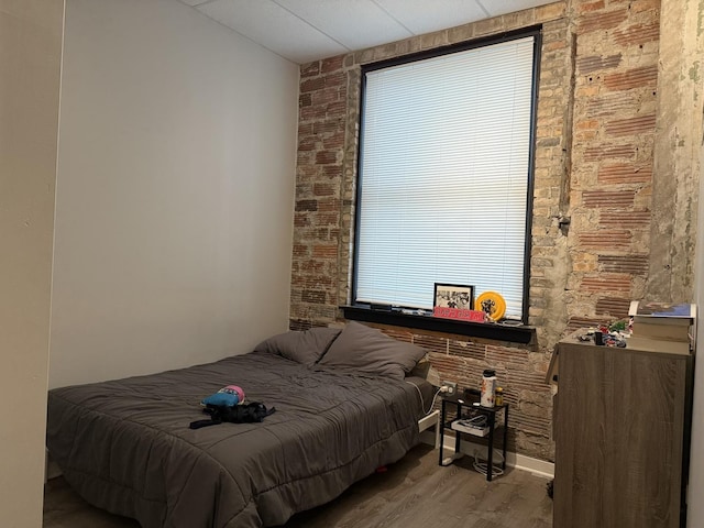 20 N State St Unit 801, Chicago, IL 60602 - bedroom featuring wood finished floors and brick wall