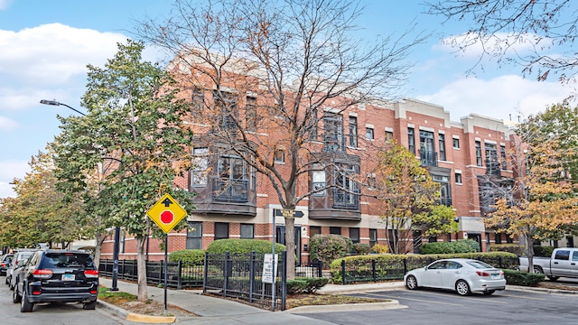 948 W 15th Pl Unit 1B, Chicago, IL 60608 - view of building exterior with uncovered parking