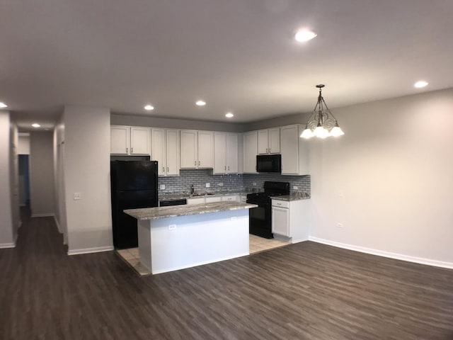 948 W 15th Pl Unit 1B, Chicago, IL 60608 - kitchen featuring black appliances, wood finished floors, a kitchen island, decorative backsplash, and recessed lighting