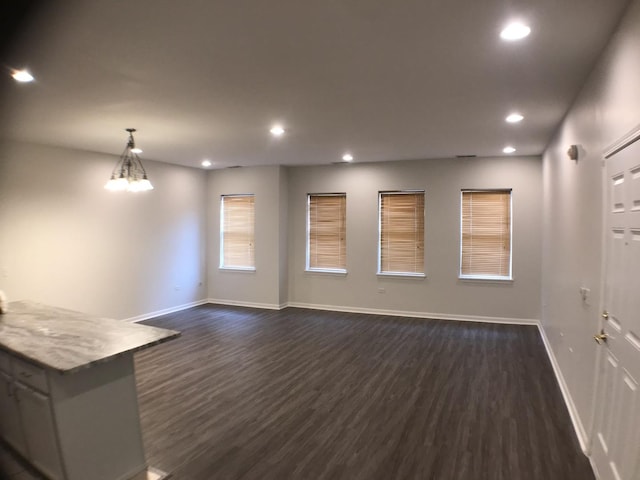 948 W 15th Pl Unit 1B, Chicago, IL 60608 - unfurnished living room featuring dark wood-style flooring, recessed lighting, and a chandelier