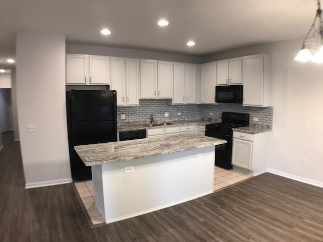 948 W 15th Pl Unit 1B, Chicago, IL 60608 - kitchen featuring black appliances, backsplash, light wood-style flooring, a center island, and recessed lighting
