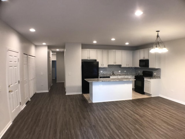 948 W 15th Pl Unit 1B, Chicago, IL 60608 - kitchen featuring black appliances, dark wood-style floors, a kitchen island, backsplash, and recessed lighting