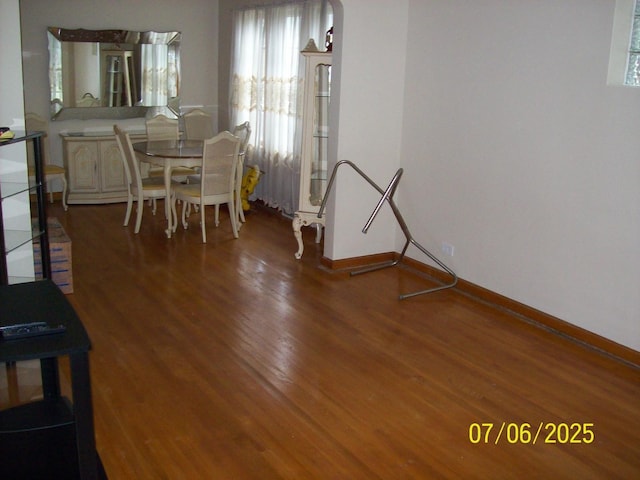 dining space with wood finished floors and healthy amount of natural light