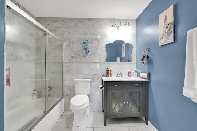 15929 Lorel Ave, Oak Forest, IL 60452 - full bath with vanity, bath / shower combo with glass door, tile patterned floors, and tile walls