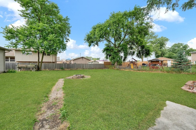 15929 Lorel Ave, Oak Forest, IL 60452 - fenced backyard featuring an outdoor fire pit