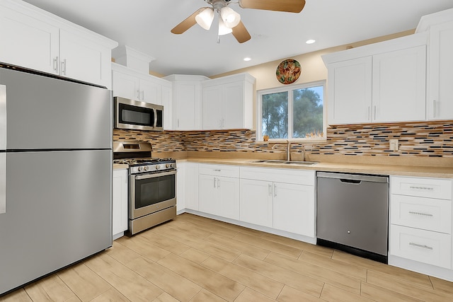 15929 Lorel Ave, Oak Forest, IL 60452 - kitchen with appliances with stainless steel finishes, ceiling fan, light countertops, decorative backsplash, and white cabinetry