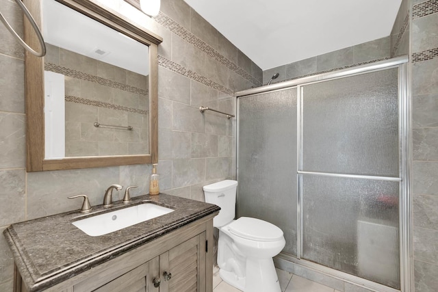 15929 Lorel Ave, Oak Forest, IL 60452 - bathroom featuring tile walls, vanity, a shower stall, tile patterned floors, and backsplash