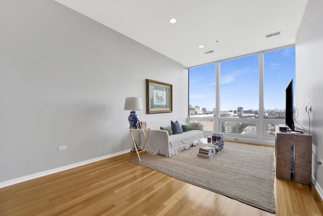500 W Superior St Unit 1004, Chicago, IL 60654 - bedroom with wood finished floors, expansive windows, and recessed lighting