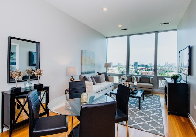 500 W Superior St Unit 1004, Chicago, IL 60654 - living area featuring expansive windows, wood finished floors, and recessed lighting