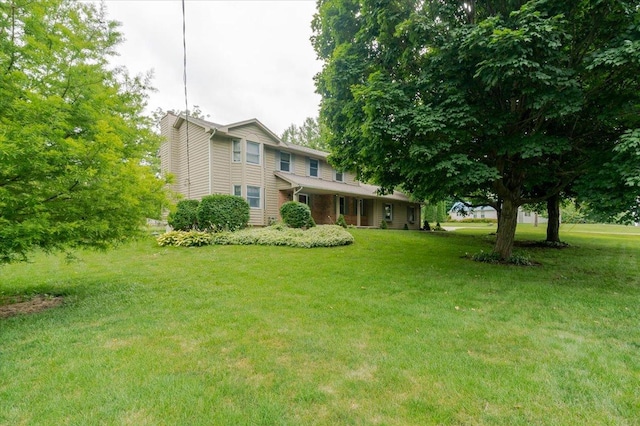 201 N Broadway St, Hudson, IL 61748 - view of front of house with a front lawn
