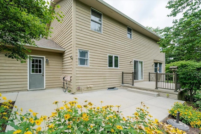 201 N Broadway St, Hudson, IL 61748 - rear view of house featuring a patio area