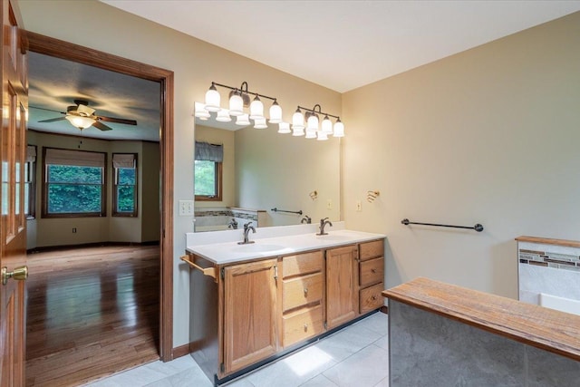 201 N Broadway St, Hudson, IL 61748 - bathroom featuring double vanity, a ceiling fan, and tile patterned flooring