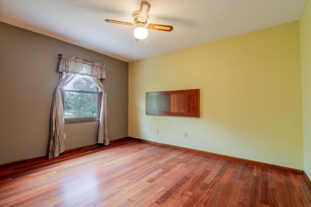 201 N Broadway St, Hudson, IL 61748 - empty room with ceiling fan and light wood finished floors