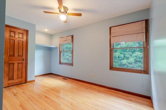 201 N Broadway St, Hudson, IL 61748 - empty room with light wood finished floors and ceiling fan