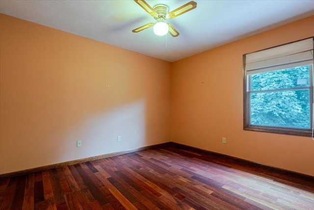 201 N Broadway St, Hudson, IL 61748 - empty room featuring dark wood finished floors and ceiling fan