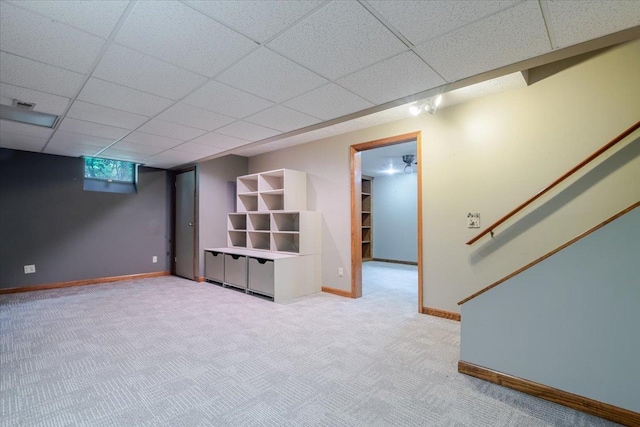201 N Broadway St, Hudson, IL 61748 - below grade area featuring carpet flooring and a paneled ceiling