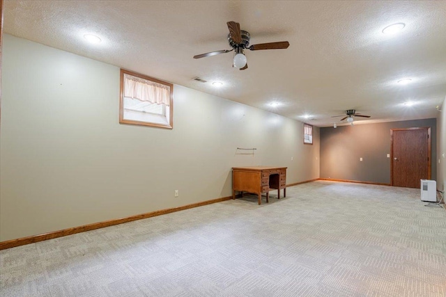201 N Broadway St, Hudson, IL 61748 - below grade area with a ceiling fan, light carpet, a textured ceiling, and recessed lighting